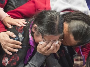 A member of the Atikamekw sharing circle is consoled during the National Inquiry Into Missing and Murdered Indigenous Women and Girls in Montreal, Tuesday, March 13, 2018.