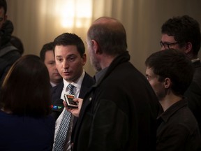 "I am sure we can adopt the two bills by Friday of this week," Simon Jolin-Barrette told reporters, seen here in April speaking to the media.
