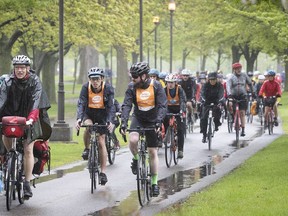 Tour de l'Ile participants make their way in the rain at René-Lévesque Park in Lachine on Sunday June 2, 2019.