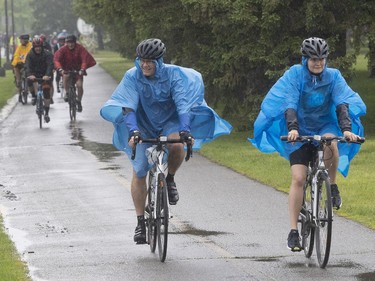 Tour de l'Ile participants make their way in the rain at René-Lévesque Park in Lachine on Sunday June 2, 2019.