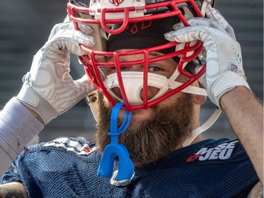 The Montreal Alouettes defensive end Gabriel Knapton dons his helmut during spring training camp at Percival Molson Stadium in Montreal on Monday June 3, 2019.