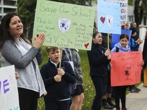 Students, parents and teachers formed a chain around General Vanier elementary school last week in a bid to save their school from being transferred to a French school board. The education minister's decision might come as early as Tuesday.