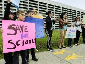 MONTREAL, QUE.: JUNE 5, 2019 -- Students, parents and teachers formed a chain around General Vanier Elementary school in the St. Léonard area of Montreal Wednesday, June 5, 2019. "to save our school, raise awareness, solidarity, and raise school spirit." The school is one of three east end schools that may be taken away from the English Montreal School Board to resolve an overcrowding problem at a French-language board. (John Kenney / MONTREAL GAZETTE) ORG XMIT: 62636