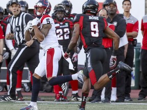 Alouettes' DeVier Posey gets behind Redblacks' Jonathan Rose for an early touchdown Thursday night at Molson Stadium. Posey is one of five international receivers fighting for a spot on Montreal's roster.