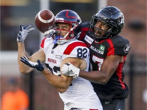 Redblacks defensive back DeAndre Farris breaks up a pass intended for Alouettes receiver Jake Weneke  during pre-season game at Molson Stadium Thursday night.