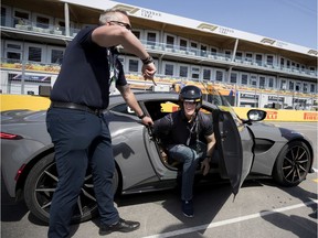 Montreal Gazette columnist Stu Cowan smiles as he returns from a test lap in an Aston Martin Vantage at Circuit Gilles-Villeneuve in Montreal on Thursday, June 6, 2019.