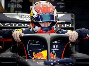 Red Bull driver Pierre Gasly of France climbs into his car for the morning Canadian Grand Prix session at Circuit Gilles-Villeneuve  in Montreal, on Saturday, June 8, 2019.