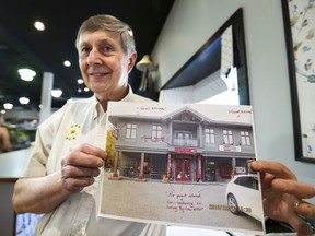 The Hub owner Stan Rutkauskas with a photo of his hardware store that he received from Beaconsfield's administration illustrating the illegal number of signs outside his store.