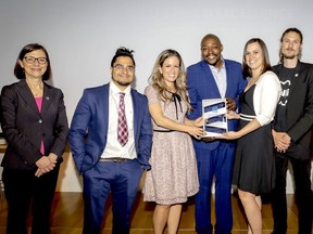 Quebec Health and Social Services Minister Danielle McCann, left, stands with AJOI representatives, Abdullah Sekkat (family outreach), AJOI executive director Tania Charron, Mardoché Mertilus (clinical coordinator) Andrée Levesque (assistant director) and Patrick Lévesque (youth outreach).