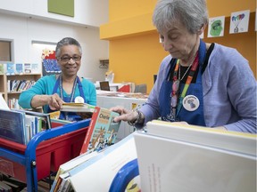 Retired librarians Jeanne Ragbir, left, and Eta Markowicz load up the Biblio-Express book carts – one filled with English books, one with French – as they prepare to visit young patients on the wards of the Montreal Children's Hospital.