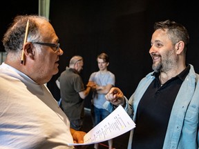 Hudson Village Theatre artistic director of professional theatre Dean Patrick Fleming, right, talks to actor Michel Perron during a rehearsal of The Drawer Boy. Pictured in background are Drawer Boy cast members Brian Dooley, left, and Curtis Legault.