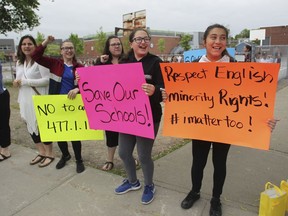 Students, former students,  parents and teachers take part in a 'human chain' protest outside of Dante School in the St-Léonard area of in Montreal, on Thursday, June 20, 2019.