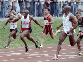 Donovan Bailey (1) watches Bruny Surin (2) finish second during finals for Olympic trials in Montreal on June 21, 1996.