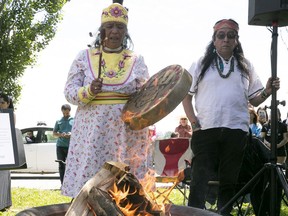 Mohawk elders do traditional songs, following the lighting of fire, during ceremonies surrounding the National Indigenous Peoples Day held in Montreal on Friday June 21, 2019.