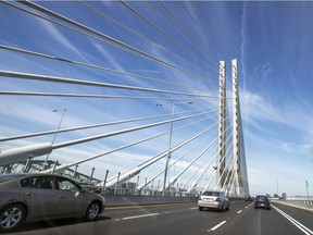 Cars cross over the new Samuel De Champlain bridge from the South Shore toward the city hours after it was opened to traffic in Montreal Monday June 24, 2019.