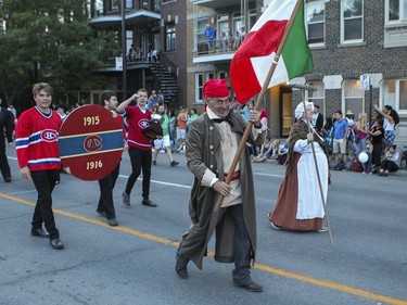 People dressed in historical garb take part in the parade for Fête Nationale on St. Denis St. In Montreal Monday, June 24, 2019.