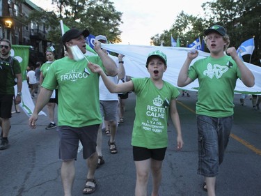 A group of Franco-Ontarians take part in the Fête Nationale parade on St. Denis St. in Montreal on Monday, June 24, 2019.