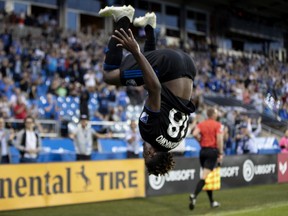 Impact forward Orji Okwonkwo celebrates after scoring against Timbers goalkeeper Jeff Attinella at Saputo Stadium Wednesday night.