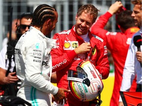 Pole position qualifier Sebastian Vettel of Germany and Ferrari and second place qualifier Lewis Hamilton of Great Britain and Mercedes GP talk during qualifying for the F1 Grand Prix of Canada at Circuit Gilles Villeneuve on Saturday, June 08, 2019, in Montreal.
