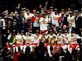 OAKLAND, CALIFORNIA - JUNE 13:  The Toronto Raptors pose for a photo after their team defeated the Golden State Warriors to win Game Six of the 2019 NBA Finals at ORACLE Arena on June 13, 2019 in Oakland, California.