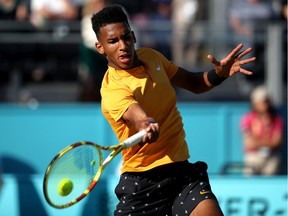 Montreal's Felix Auger-Aliassime plays a forehand during semifinal against Feliciano Lopez of Spain at the Fever-Tree Championships on June 22, 2019, in London.