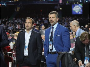 Canadiens owner/president Geoff Molson (left) and general manager Marc Bergevin take a break during second day of NHL Draft in Vancouver on June 22, 2019.