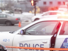 A Montreal police car with crime-scene tape.