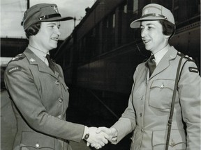 In this photo from our archives, Lt.-Col. Joan Kennedy (left) of the Canadian Women's Army Corps is greeted by Lieut. M. Nation, a CWAC recruiting officer, at Bonaventure Station in Montreal on June 8, 1943. Kennedy had just returned from Britain.