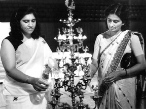 Manjit Rajwans (left) and Saramma Kurien light a symbolic Indian oil lamp at a July 6, 1985 interfaith memorial service at the Pierre Charbonneau Centre in Montreal for victims of the Air India bombing. The bombing, which took 329 lives, occurred on June 23, 1985.