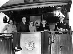 In this photo dated June 12, 1947, U.S. President Harry Truman (second from left) poses for a photo from his presidential train at the Canada-U.S. border, along with family members and aides. From left: Maj.-Gen. Harry Hl Vaughan, military aide; Truman; Margaret Truman (the president's daughter); wife Bess Truman; and Rear Admiral Foskett of the U.S. Navy. The Trumans visited Canada June 10-12, 1947.