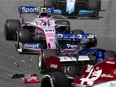 MONTREAL, QUE.: June 9, 2019 -- Racing Point BWT Mercedes driver Lance Stroll (18) of Canada heads in to the first corner trying to avoid debris from Scuderia Toro Rosso Honda driver Alexander Albon's car during the Canadian Grand Prix at the Circuit Gilles Villeneuve in Montreal, on Sunday, June 9, 2019.