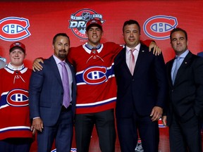 Ryan Poehling poses for photo with Canadiens assistant GM Trevor Timmins (left), director of amateur scouting Shane Churla and team owner/president Geoff Molson after being selected in the first round (25th overall) at the 2017 NHL Draft in Chicago.