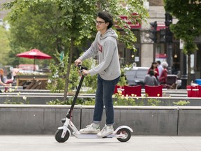 Timothy Baldacchino of Dyad Cycles rides an electric scooter around Prince Arthur St. last week.