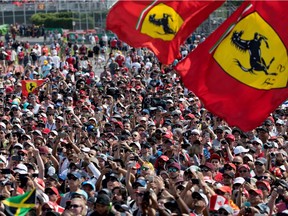 Racing fans crowd around the podium during the Canadian Grand Prix at Circuit Gilles Villeneuve in Montreal on June 11, 2017.