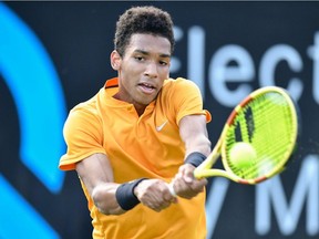 Canada's Felix Auger-Aliassime returns the ball to France's Gilles Simon during their round-of-16 match at the ATP Mercedes Cup tennis tournament in Stuttgart, southwestern Germany, on June 13, 2019.