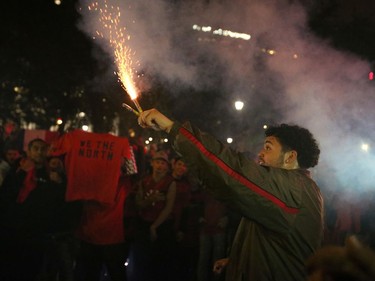 Fans light flares as they celebrate their win in Game 6 of the NBA basketball finals between the Toronto Raptors and the Golden State Warriors in Montreal June 13, 2019.