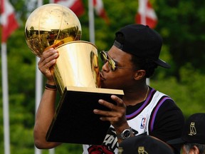 Toronto Raptors guard Kyle Lowry kisses the Larry O'Brien NBA Championship Trophy during Toronto Raptors victory parade celebration in Toronto, Ontario, Canada, June 17, 2019.