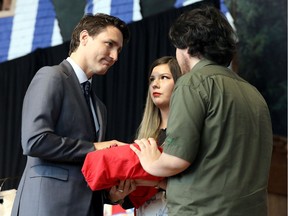 Canada's Prime Minister Justin Trudeau is presented with the final report during the closing ceremony of the National Inquiry into Missing and Murdered Indigenous Women and Girls in Gatineau, June 3, 2019.