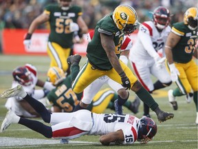 Montreal Alouettes' Marcus Cromartie (15) misses the tackle on Edmonton Eskimos' C.J. Gable (2) in Edmonton on Friday June 14, 2019.