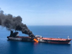Suspected attacks left two tankers in flames in the waters of the Gulf of Oman on Thursday, June 13.