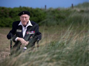 Canadian WWII veteran Ernest Cote poses on June 5, 2014 in Courseulles-sur-mer, Normandy, on the beach where he landed 70 years ago as part of the Overlord D-Day operations.