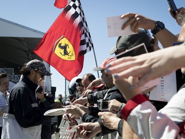 Mercedes AMG Petronas Motorsport driver Lewis Hamilton signs autographs during the annual Grand Prix open house at Circuit Gilles Villeneuve in Montreal on Thursday, June 6, 2019.