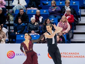 Canadian pairs skaters Nikolaj Sorensen (right) and Laurence Fournier Beaudry