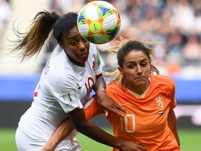 Canada's defender Ashley Lawrence, left, vies with Netherlands' midfielder Danielle van de Donk during the France 2019 Women's World Cup Group E football match between the Netherlands and Canada, on June 20, 2019, at the Auguste-Delaune Stadium in Reims, eastern France.