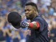 David Ortiz salutes the fans after getting a gift before the game between the Toronto Blue Jays and Boston Red Sox in Toronto, Ont. on Friday September 9, 2016. Craig Robertson/Toronto Sun