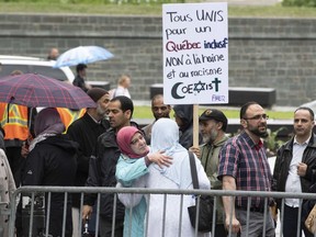 People demonstrate against a legislation on secularism and against racism, Tuesday, June 11, 2019 at the legislature in Quebec City.