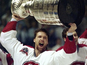 Patrick Roy holds the Stanley Cup aloft after the Canadiens won the NHL playoffs in 1993.