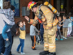 Montreal firefighters responded to a call from the Quebec Society for Disabled Children at the corner of Rene Levesque Blvd. And Atwater Street in Montreal on Monday June 3, 2019. Kids safely returned to the building after a small fire was dealt with by the fire department. Dave Sidaway / Montreal Gazette