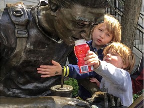 Connecticut brothers 2-year-old Jude and 5-year-old Ronan checked out the street art with their aunt and uncle on Sherbrooke St near McGill University in Montreal on Tuesday June 4, 2019.