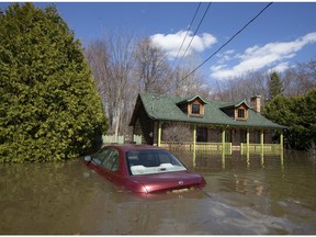 A submerged car is seen in Ste-Marthe-sur-le-Lac on April 30, 2019.